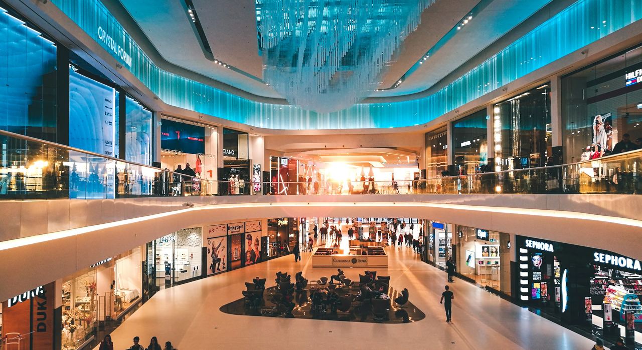 Retail centre atrium with layered balconies and daylight